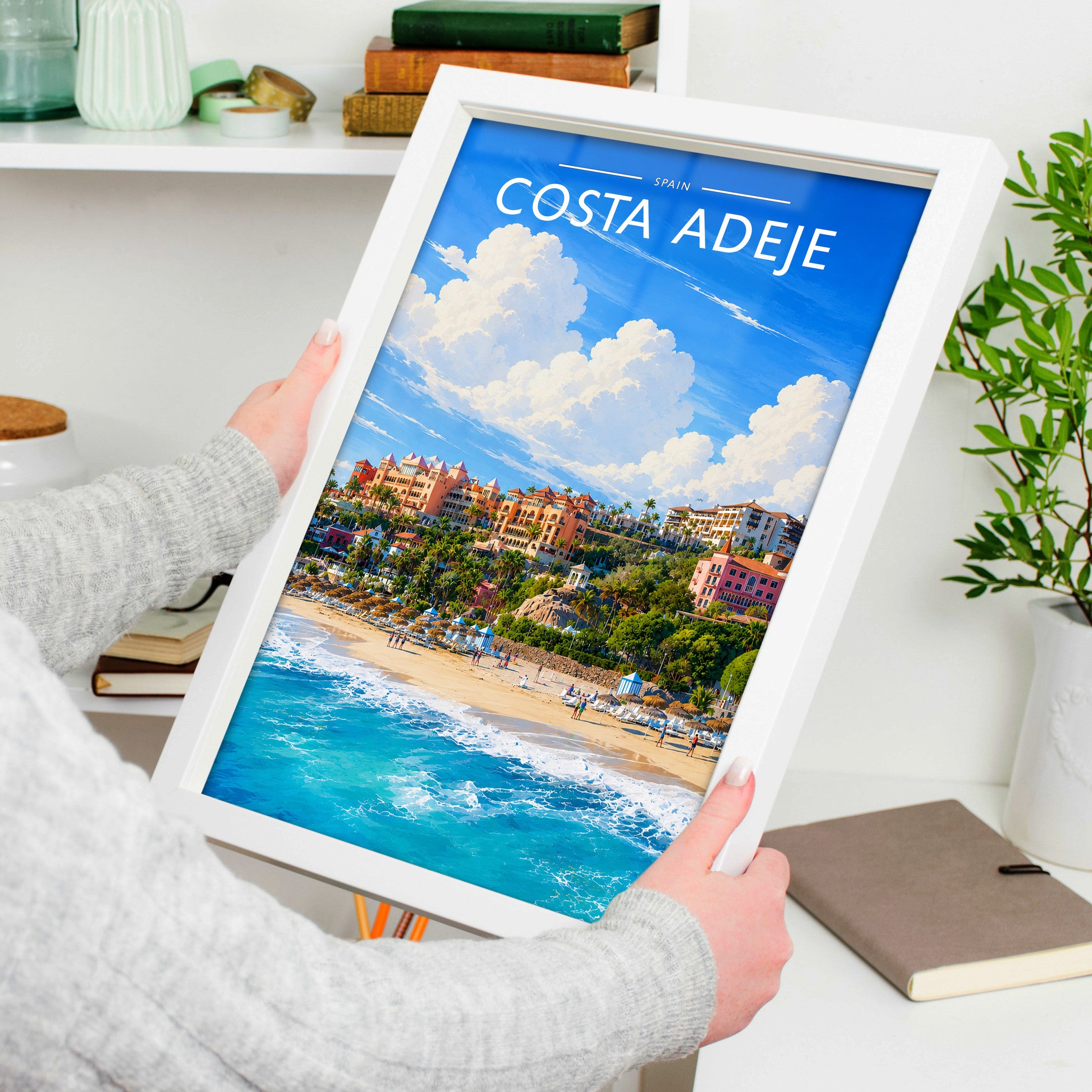 Costa Adeje #4 Travel Poster in a white frame, held to show scale