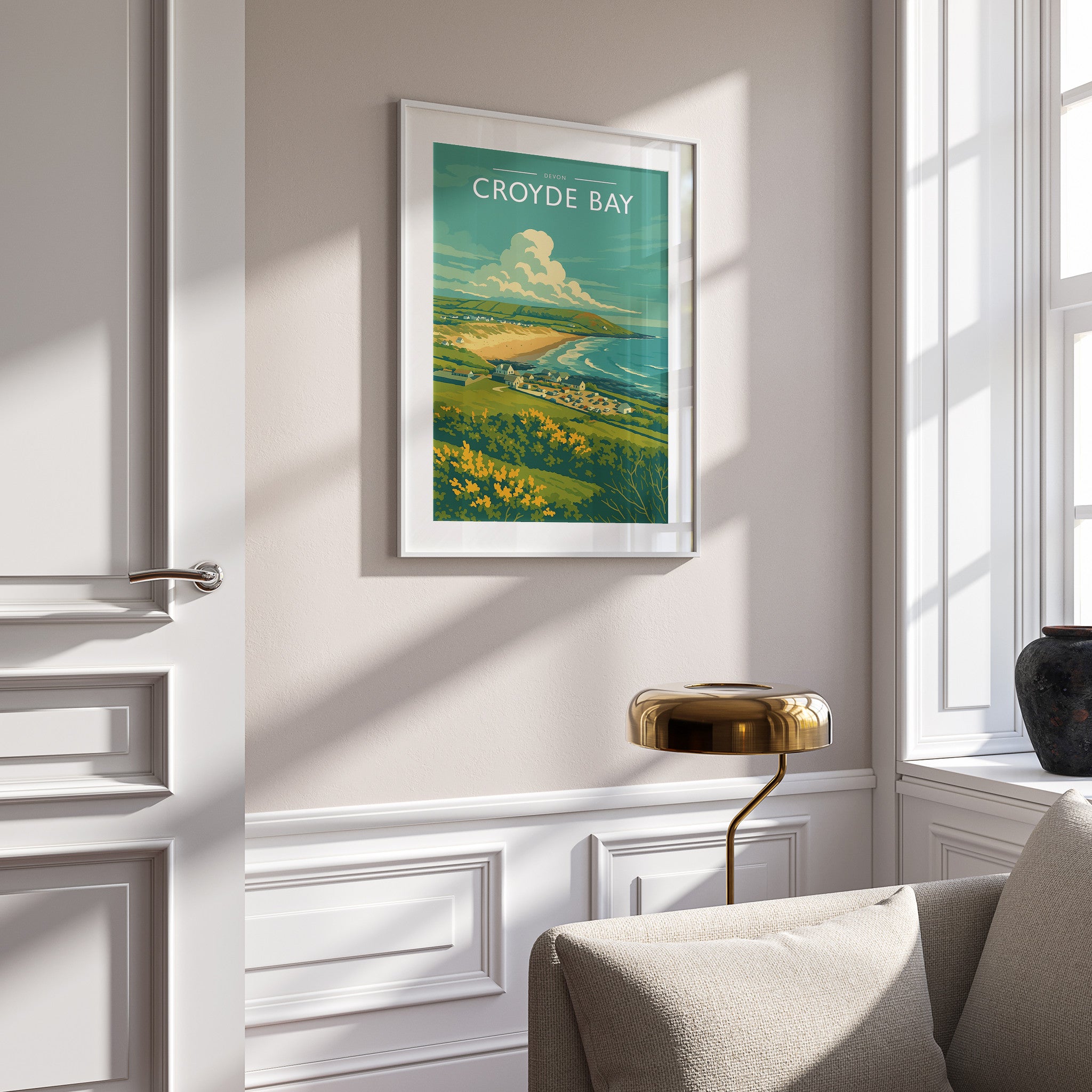 Croyde Bay Travel Poster in a white frame on a panelled wall