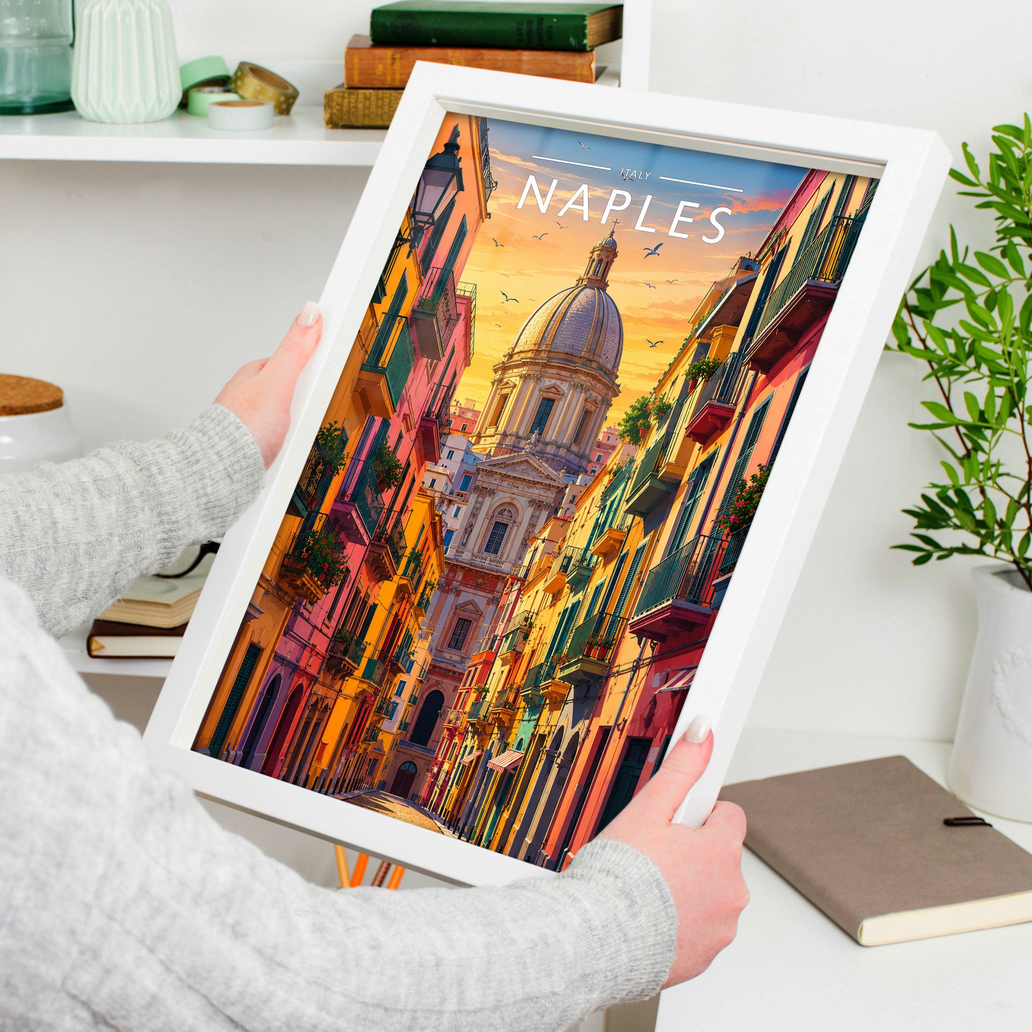 Naples Travel Poster in a white frame, held to show scale