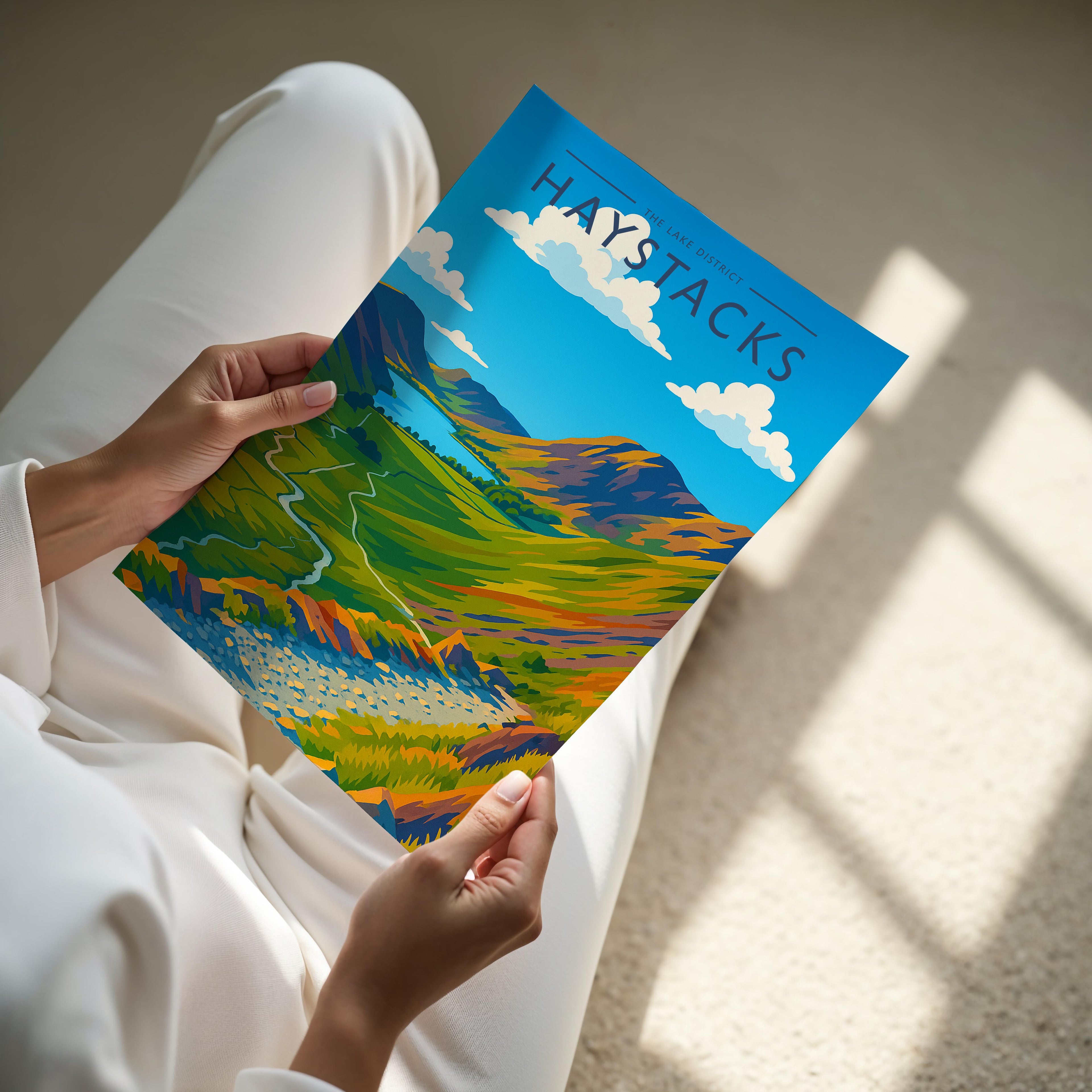 Haystacks Travel Poster - A4 print held in hand