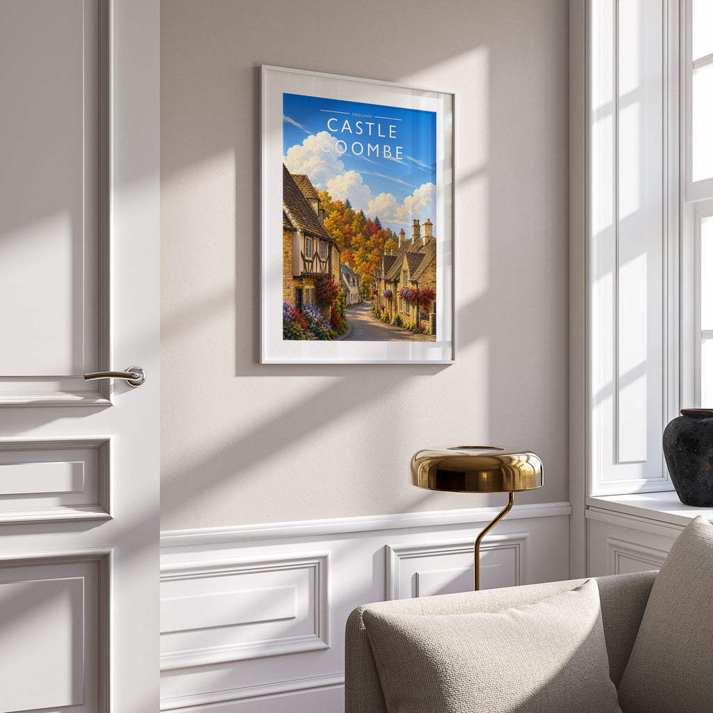 Castle Combe Travel Poster in a white frame on a panelled wall