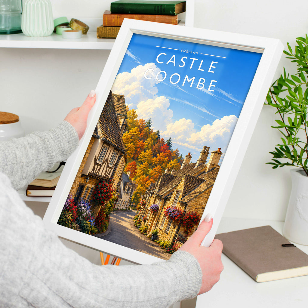 Castle Combe Travel Poster in a white frame, held to show scale