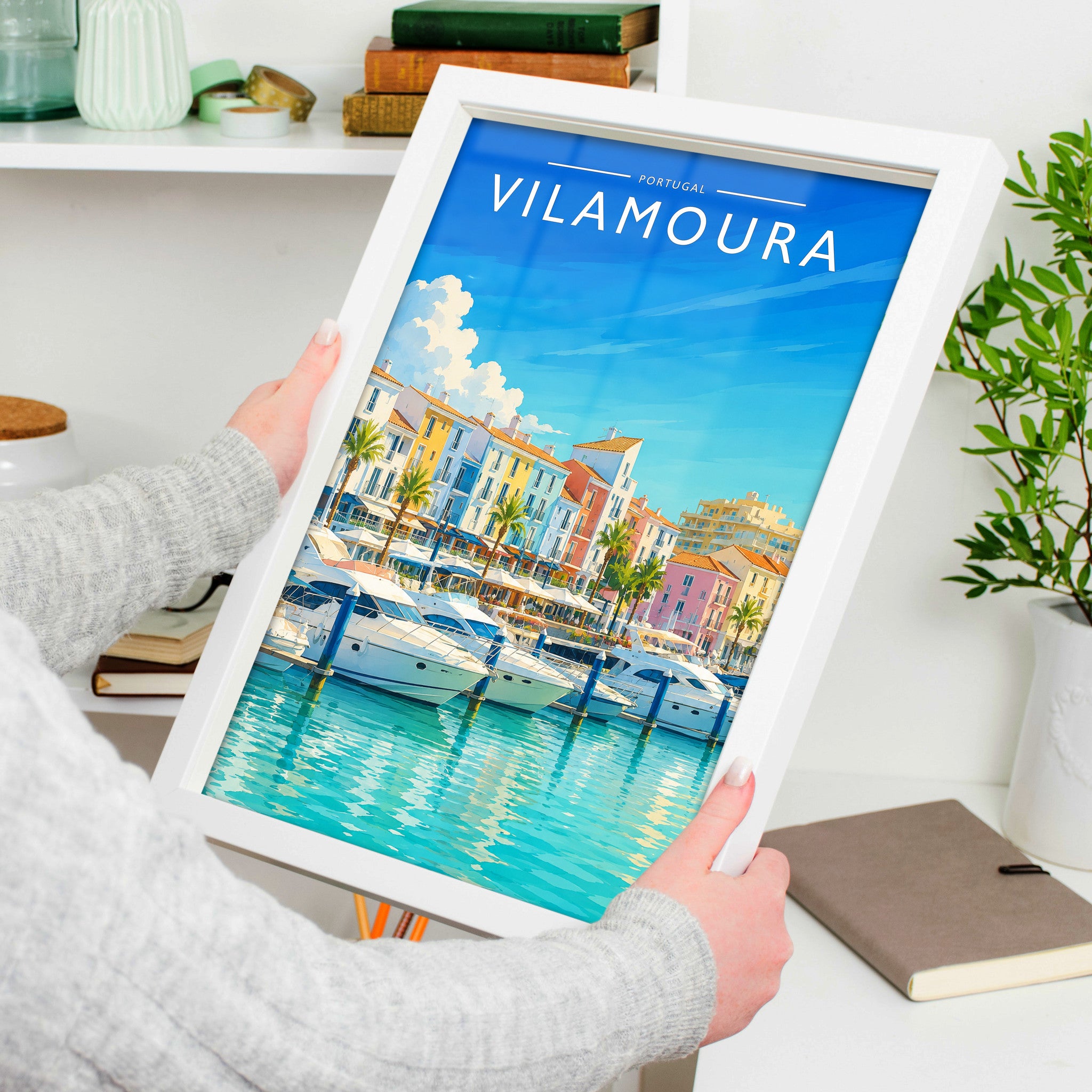 Vilamoura Travel Poster in a white frame, held to show scale