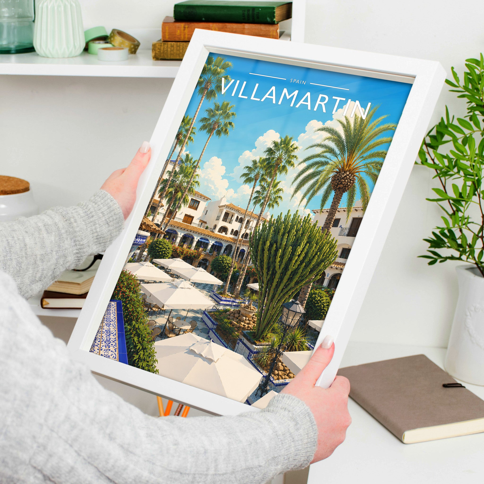 Villamartin #2 Travel Poster in a white frame, held to show scale