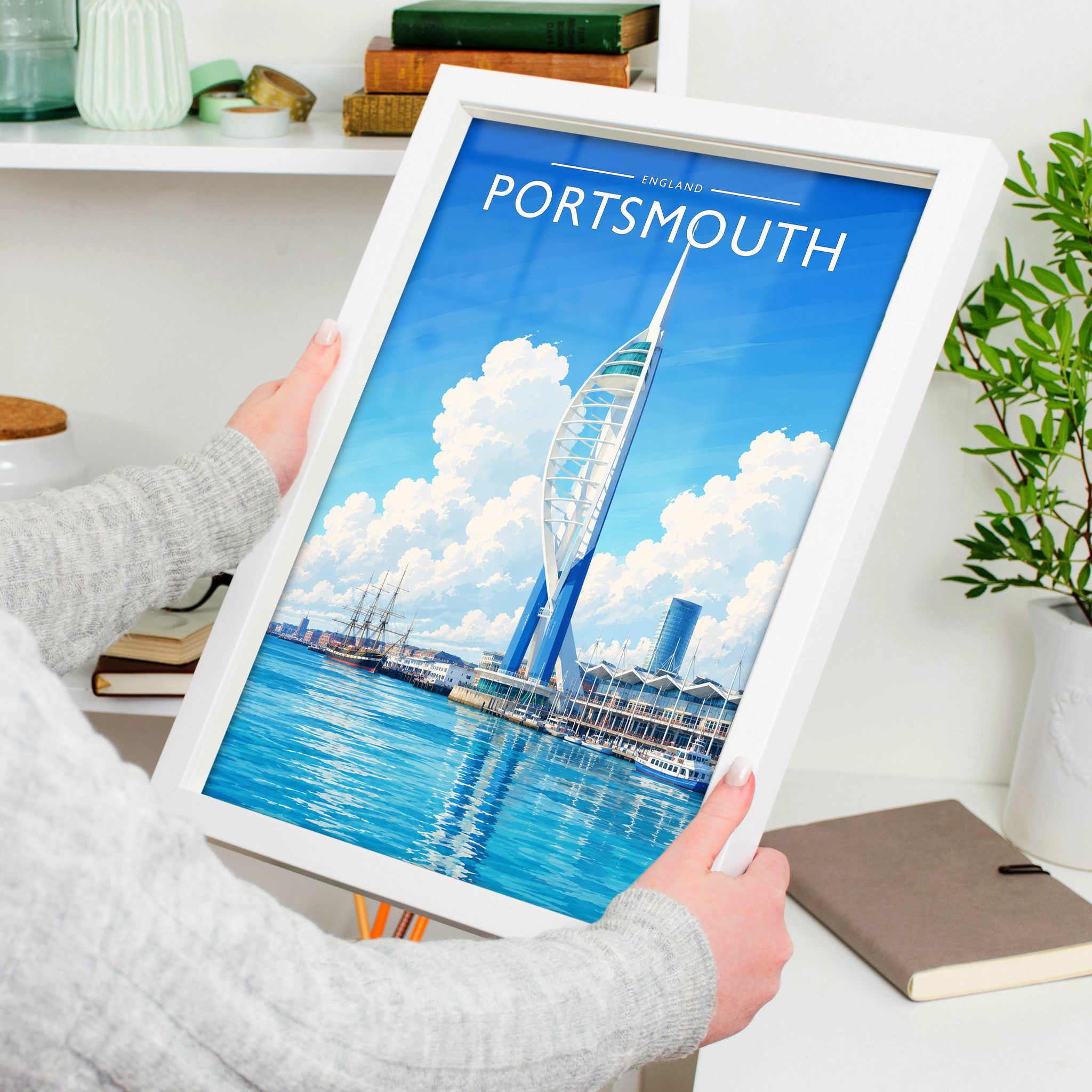Portsmouth Travel Poster in a white frame, held to show scale