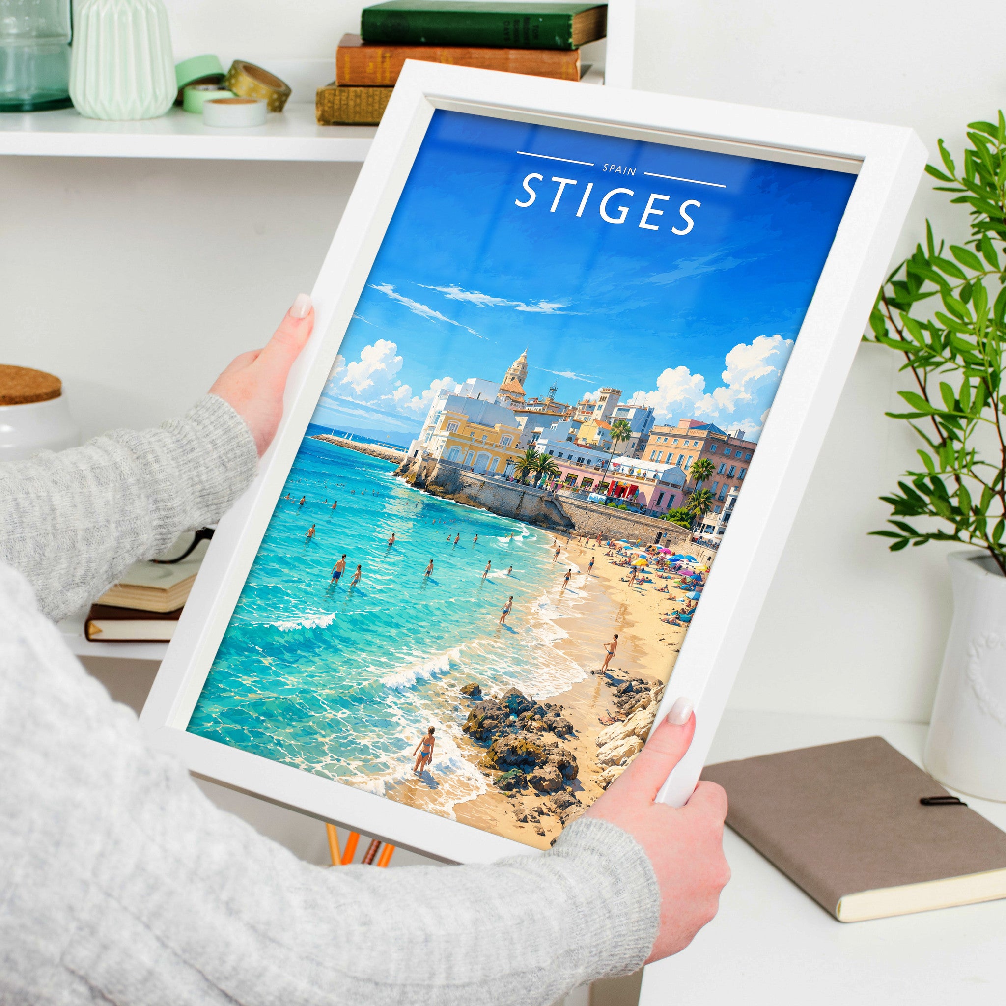 Sitges Travel Poster in a white frame, held to show scale