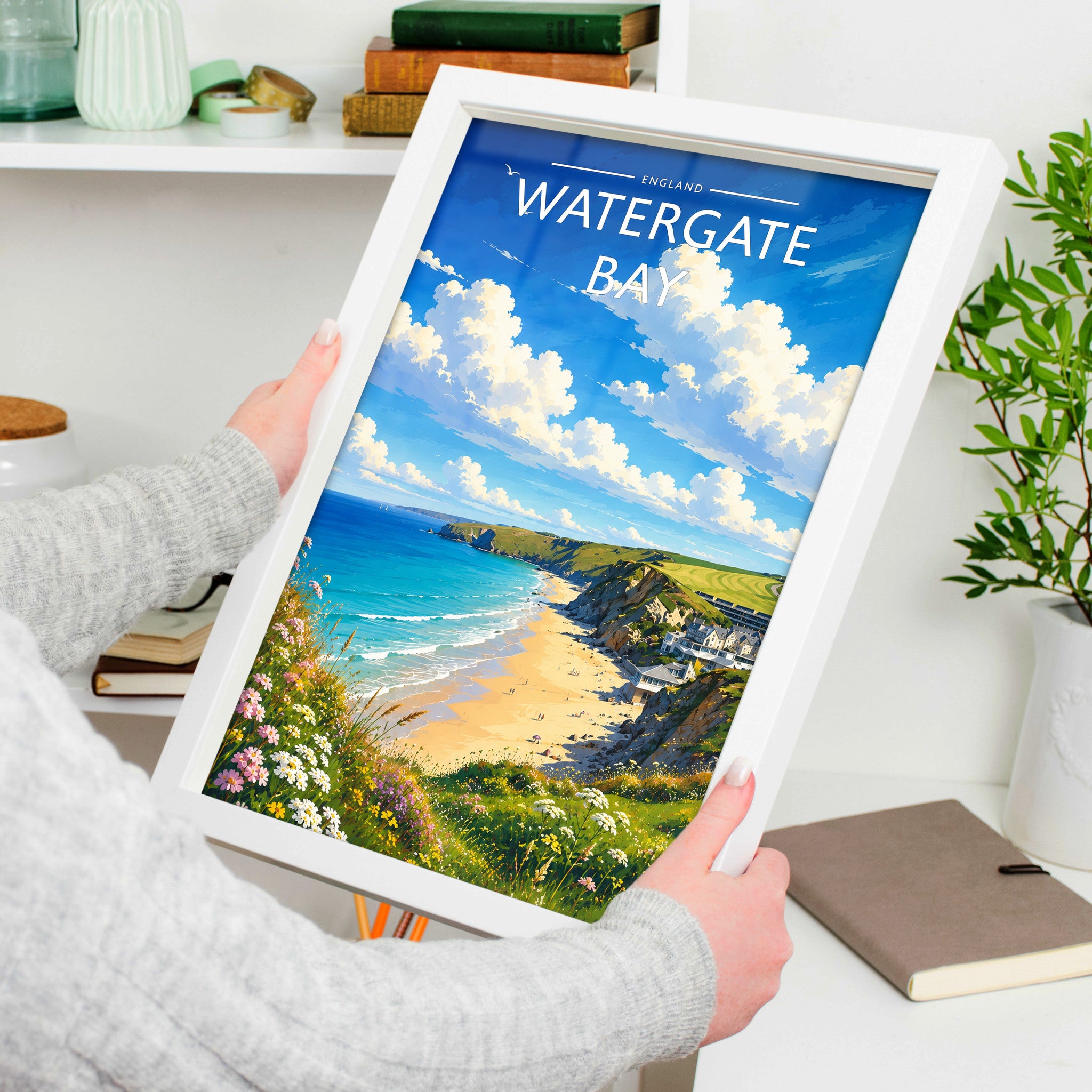 Watergate Bay Travel Poster in a white frame, held to show scale