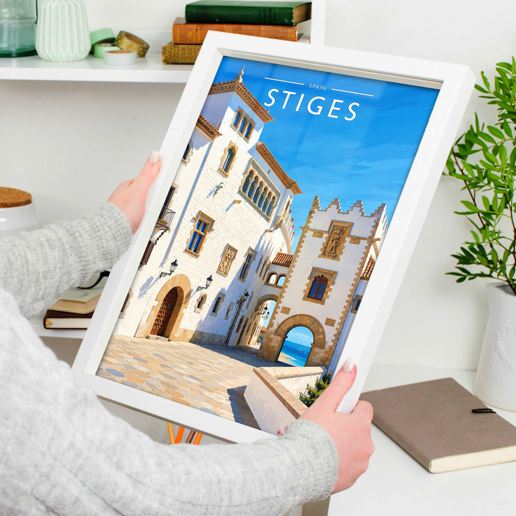 Sitges #2 Travel Poster in a white frame, held to show scale
