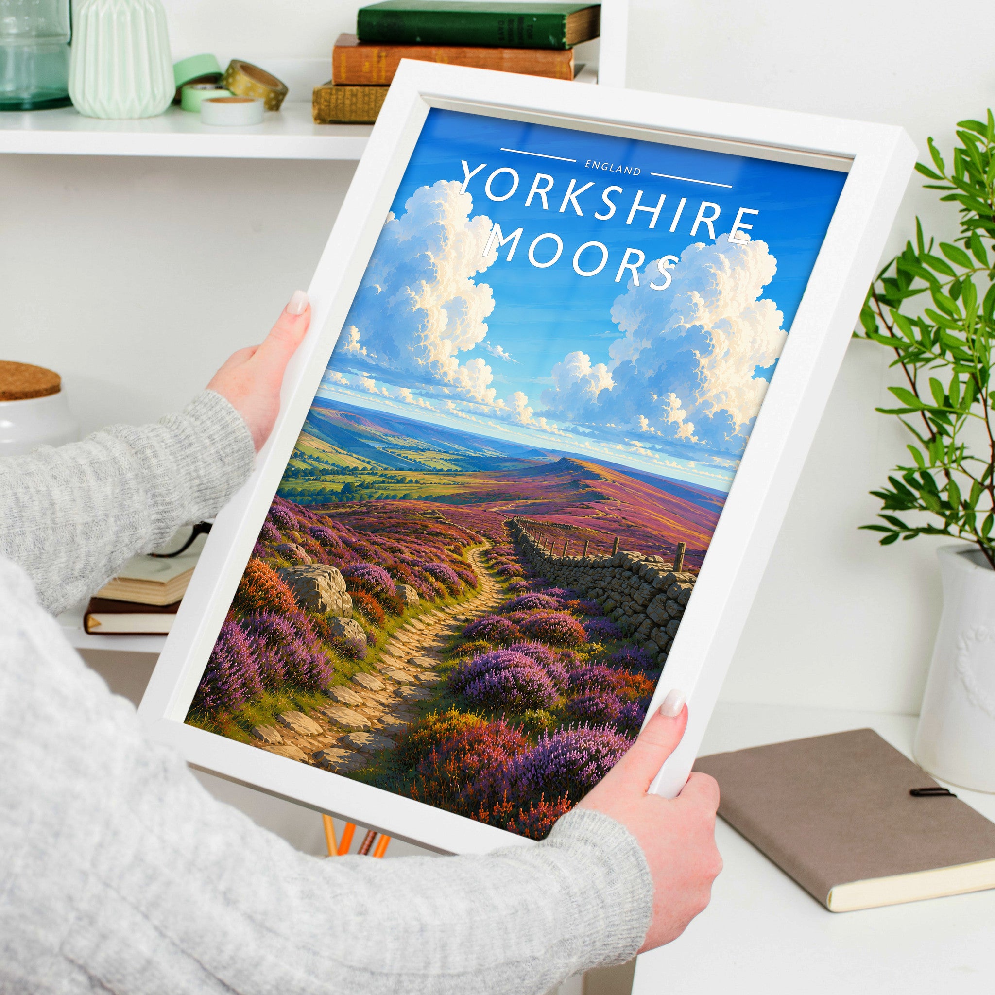 Yorkshire Moors #3 Travel Poster in a white frame, held to show scale
