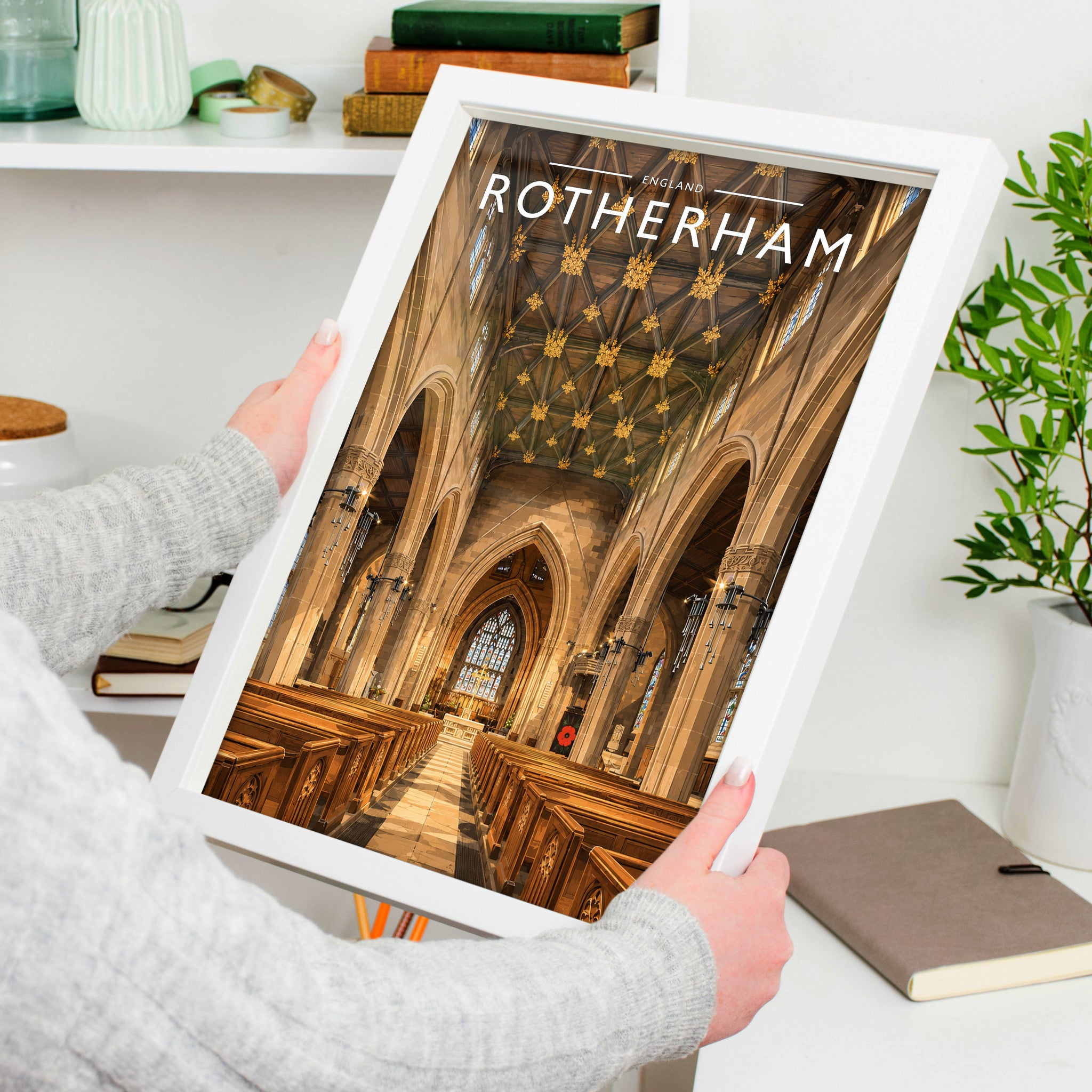 Rotherham #2 Travel Poster in a white frame, held to show scale