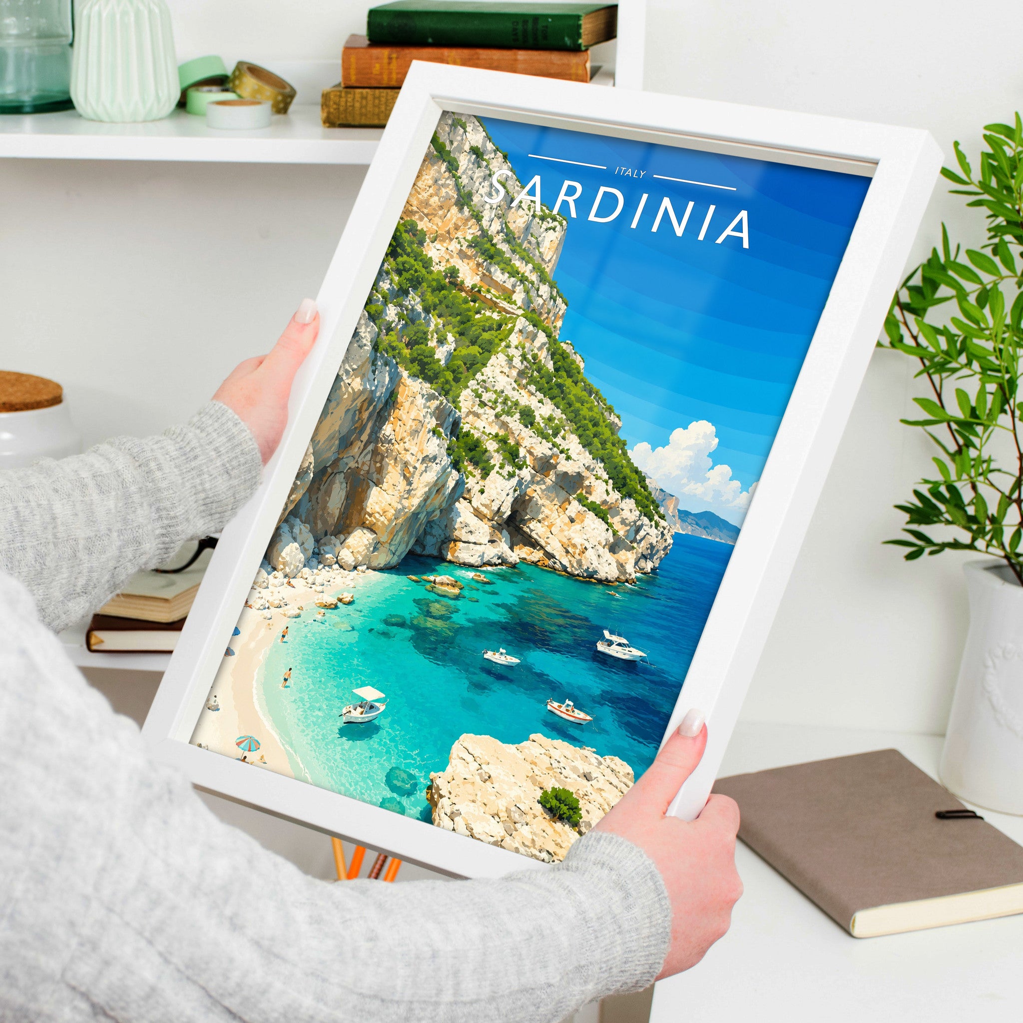 Sardinia #2 Travel Poster in a white frame, held to show scale