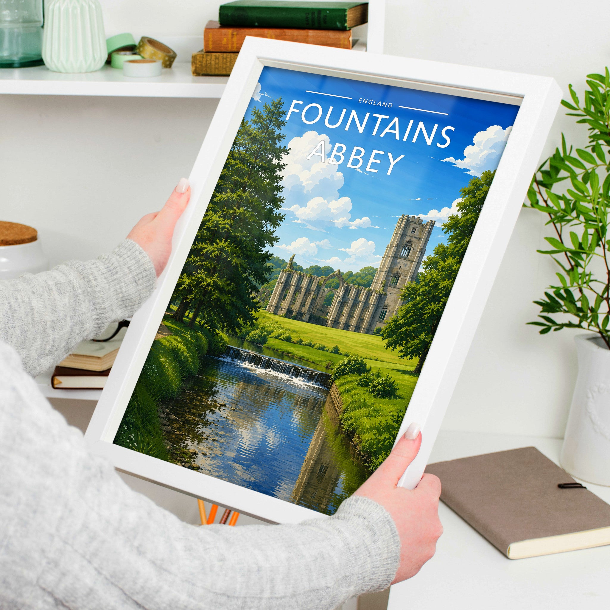 Fountains Abbey Travel Poster in a white frame, held to show scale