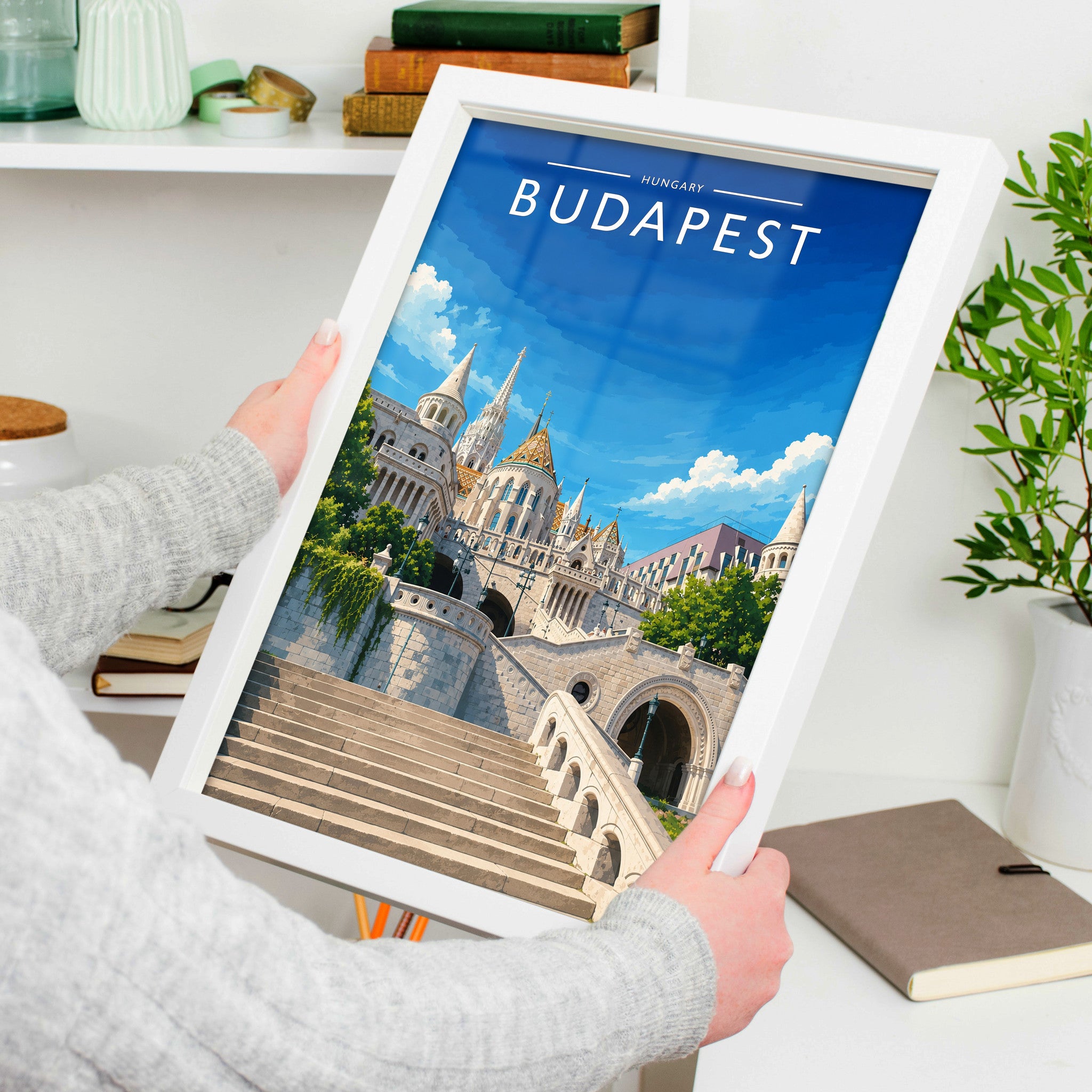 Budapest #2 Travel Poster in a white frame, held to show scale