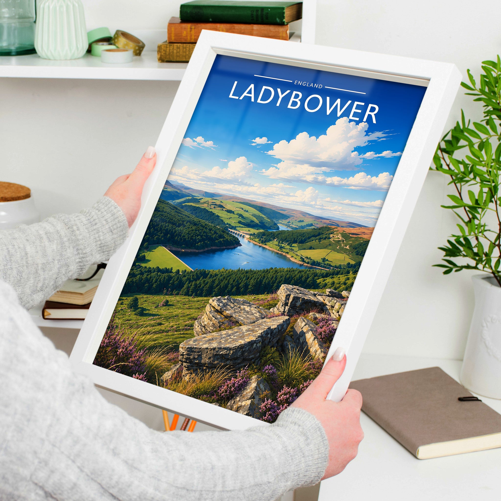 Ladybower Travel Poster in a white frame, held to show scale