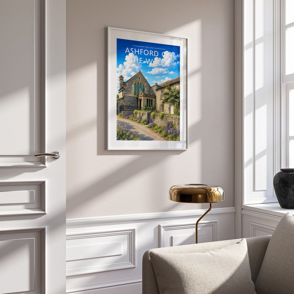 Ashford on the Water Travel Poster in a white frame on a panelled wall