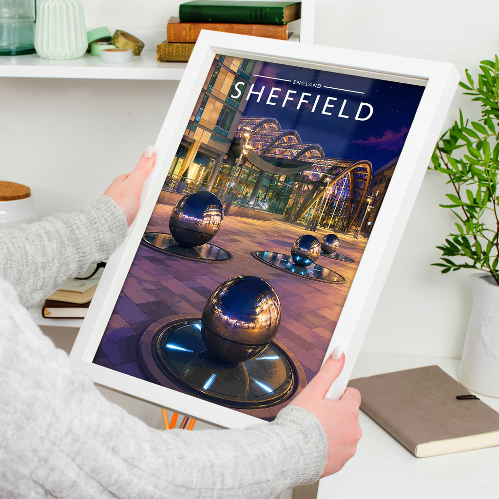 Sheffield #5 Travel Poster in a white frame, held to show scale