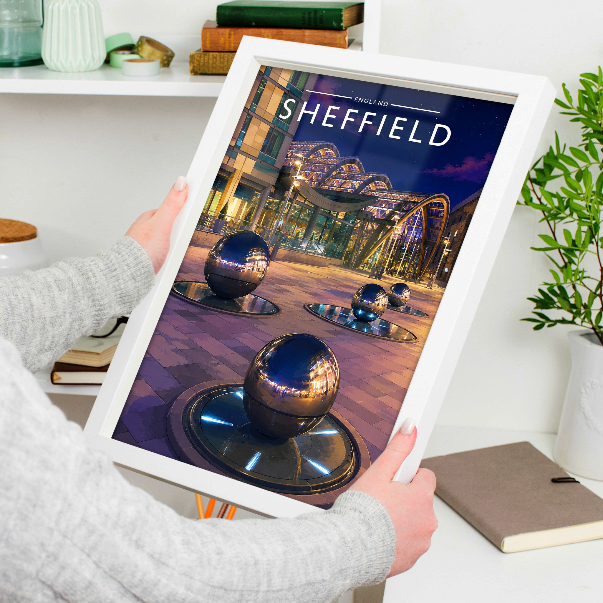 Sheffield #5 Travel Poster in a white frame, held to show scale