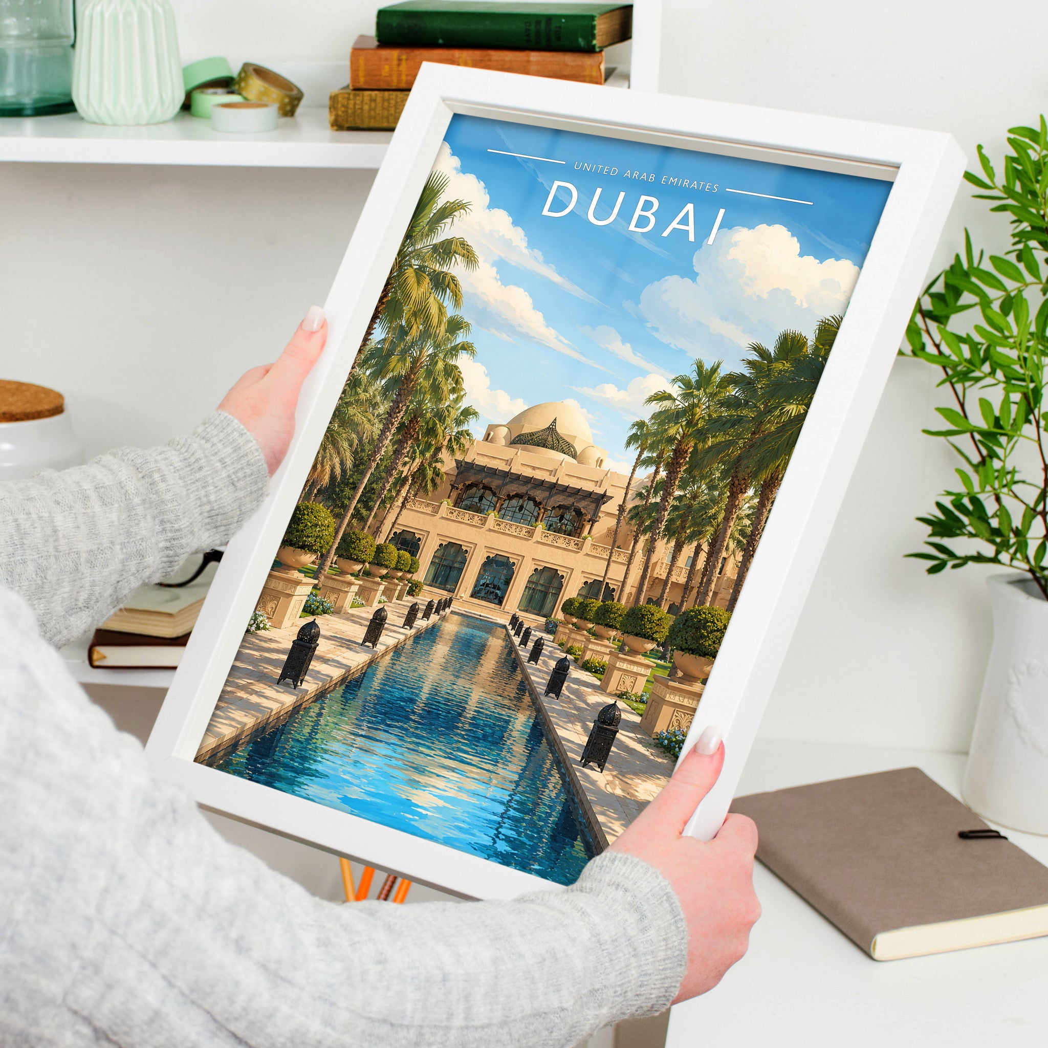 Dubai Travel Poster in a white frame, held to show scale