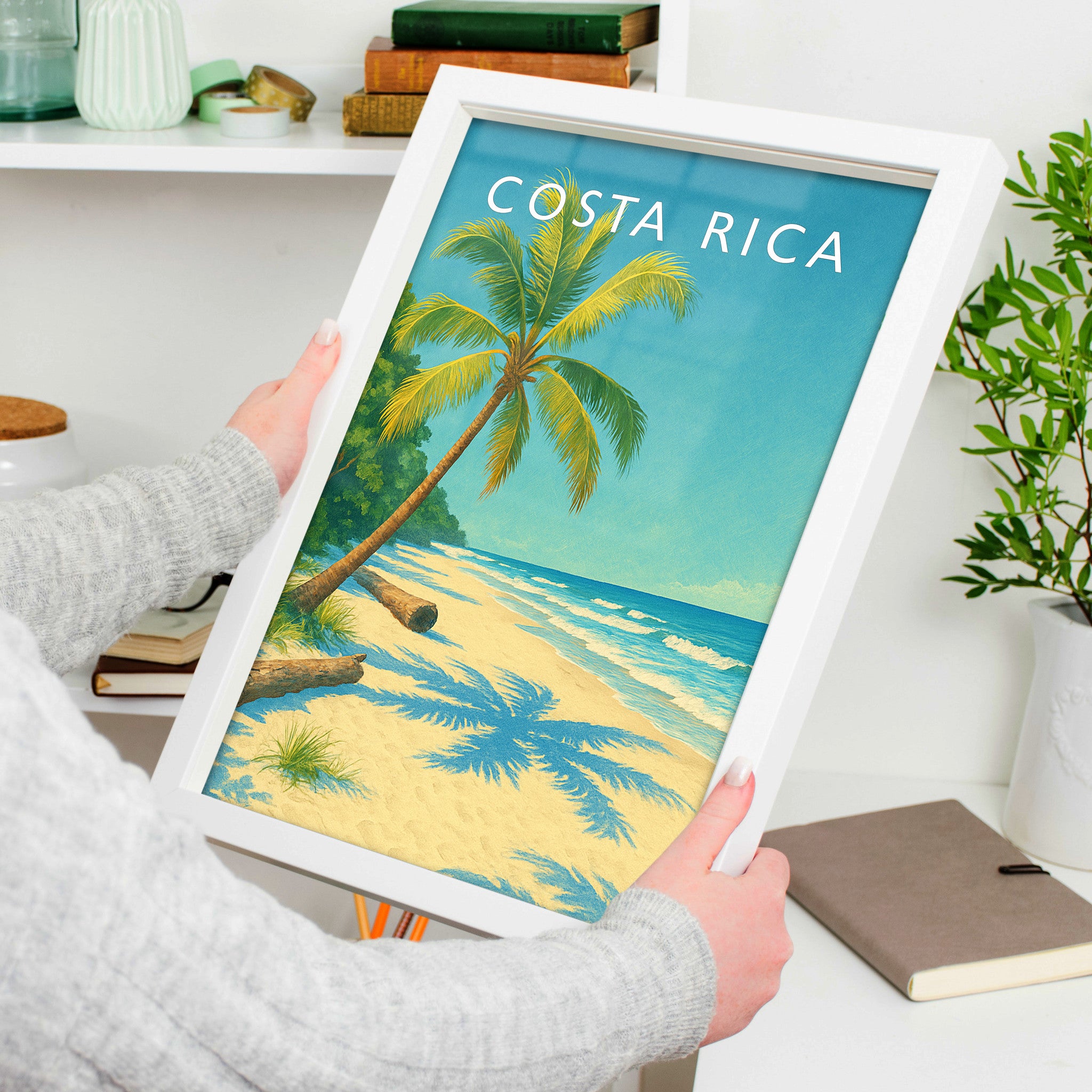Costa Rica Travel Poster in a white frame, held to show scale