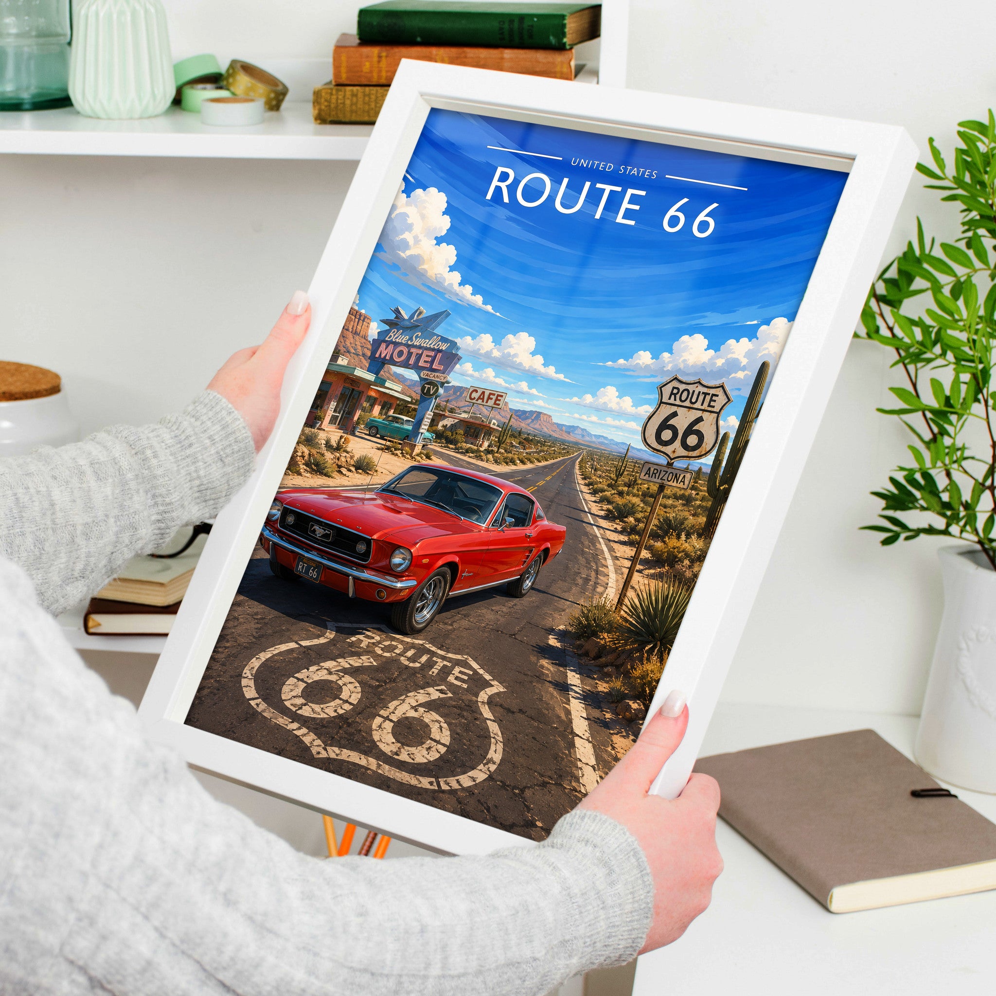 Route 66 Travel Poster in a white frame, held to show scale