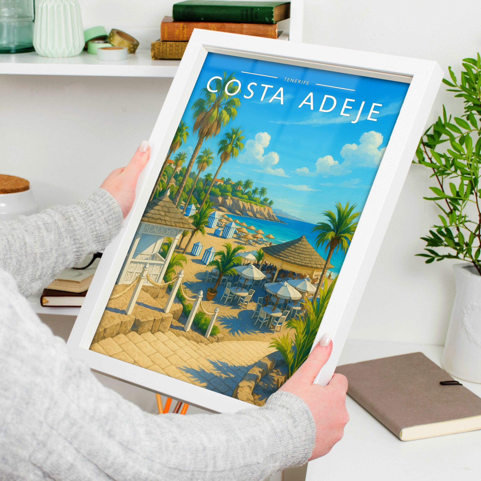 Costa Adeje Travel Poster in a white frame, held to show scale