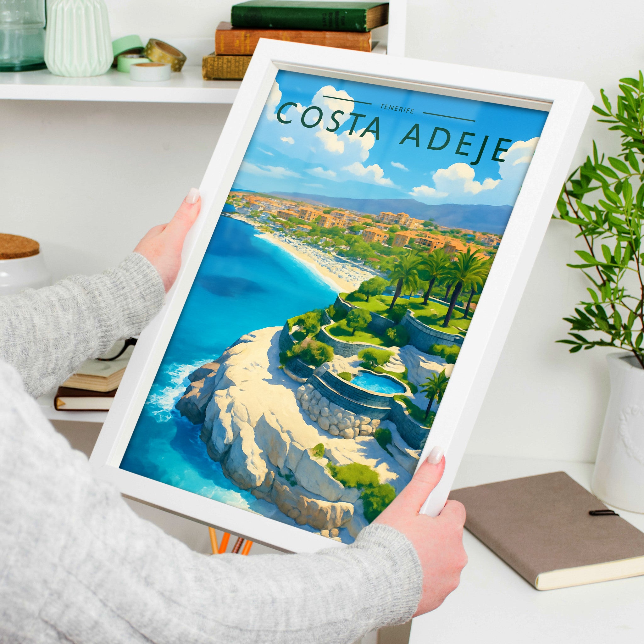 Costa Adeje #2 Travel Poster in a white frame, held to show scale