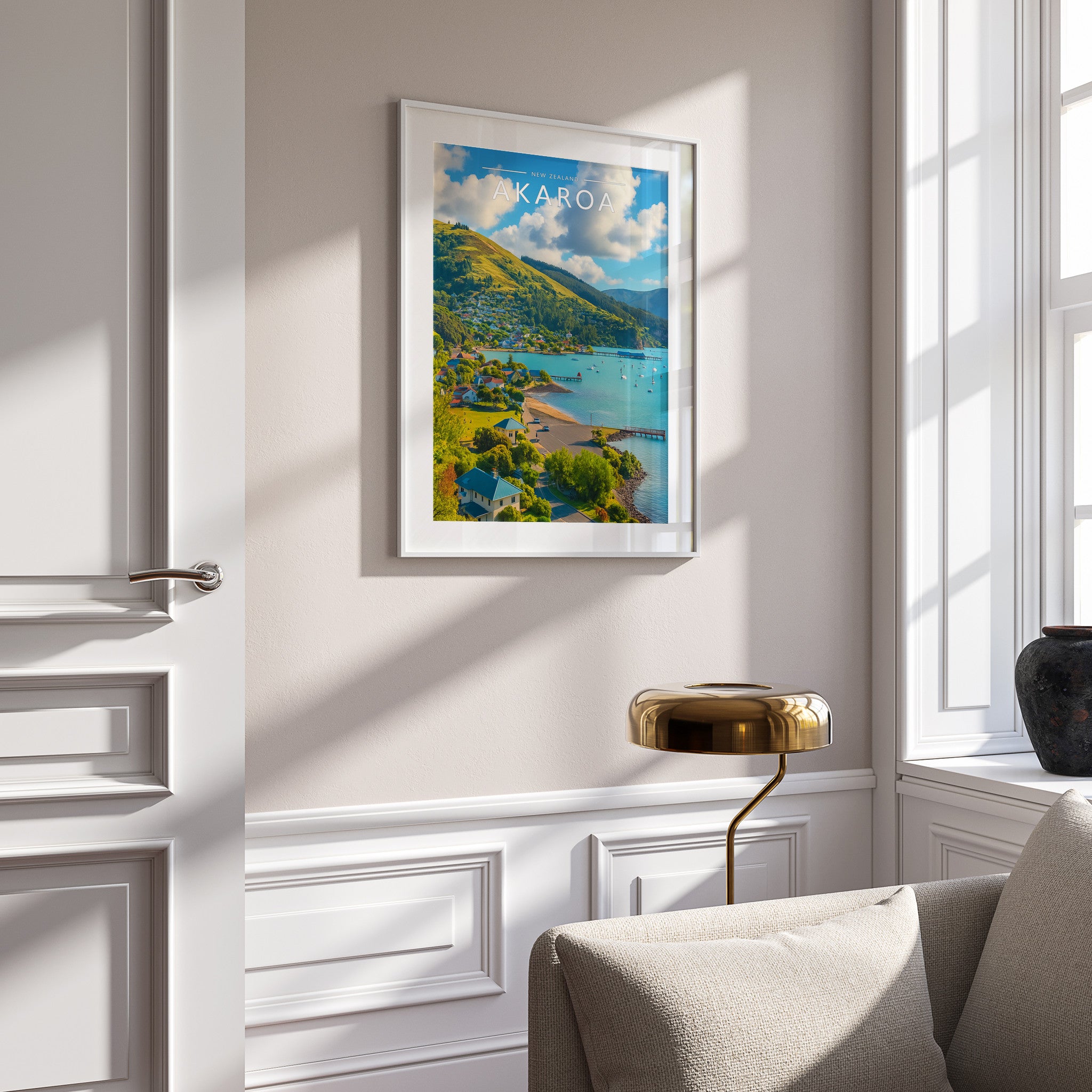 Akaroa Travel Poster in a white frame on a panelled wall