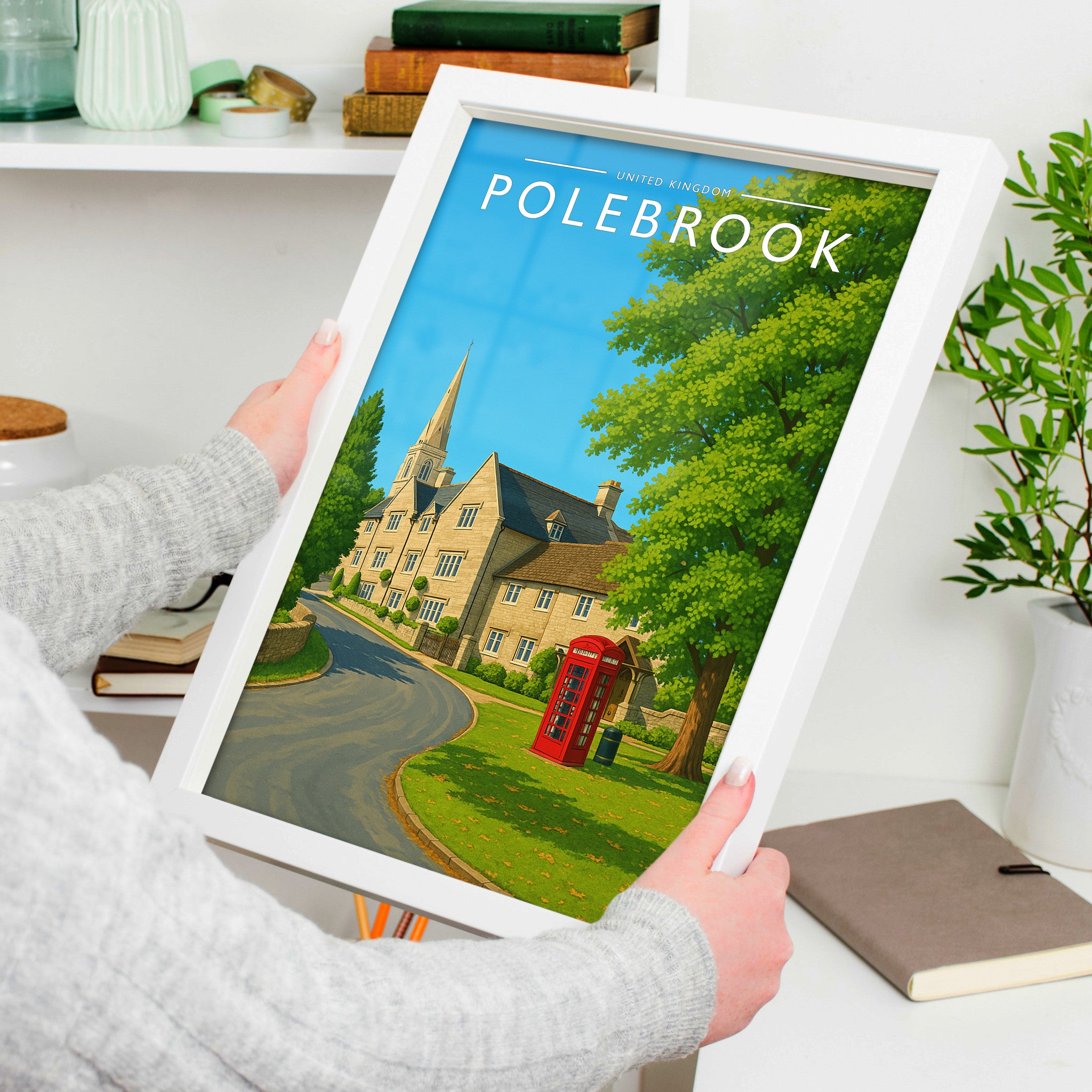 Polebrook Travel Poster in a white frame, held to show scale